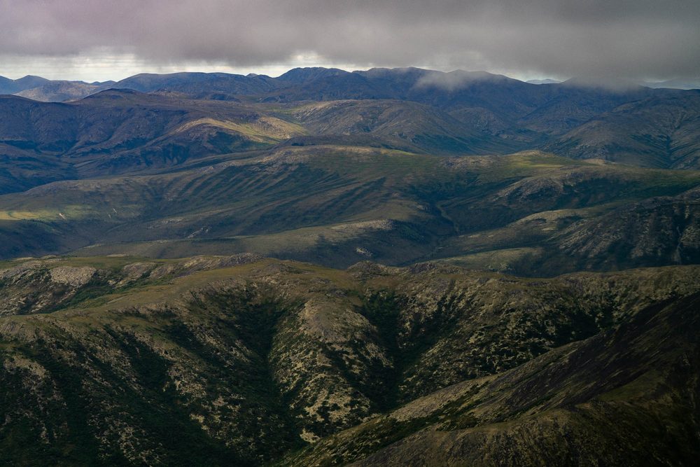 Dark ridgelines of the Brooks Range under heavy cloud