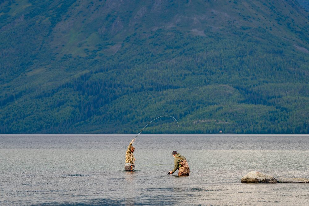 Will and Jim Pattiz wading a lake below the Brooks Range, one of them mid-cast