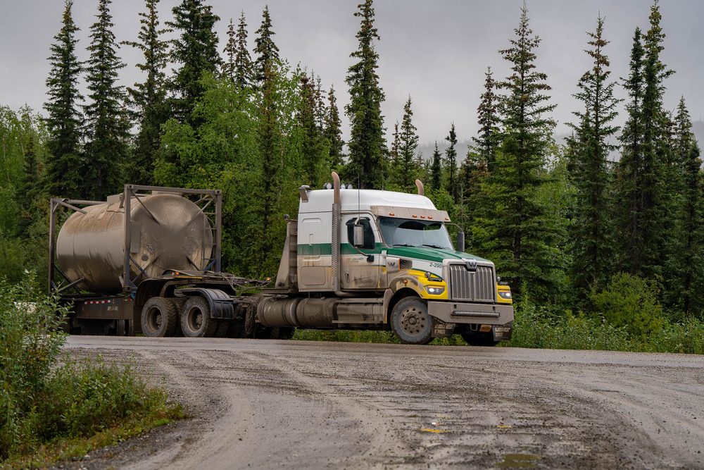 A tanker truck turning off the Dalton Highway at the Coldfoot junction
