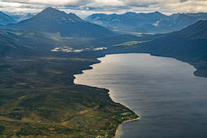 A long narrow lake held between mountain ridges