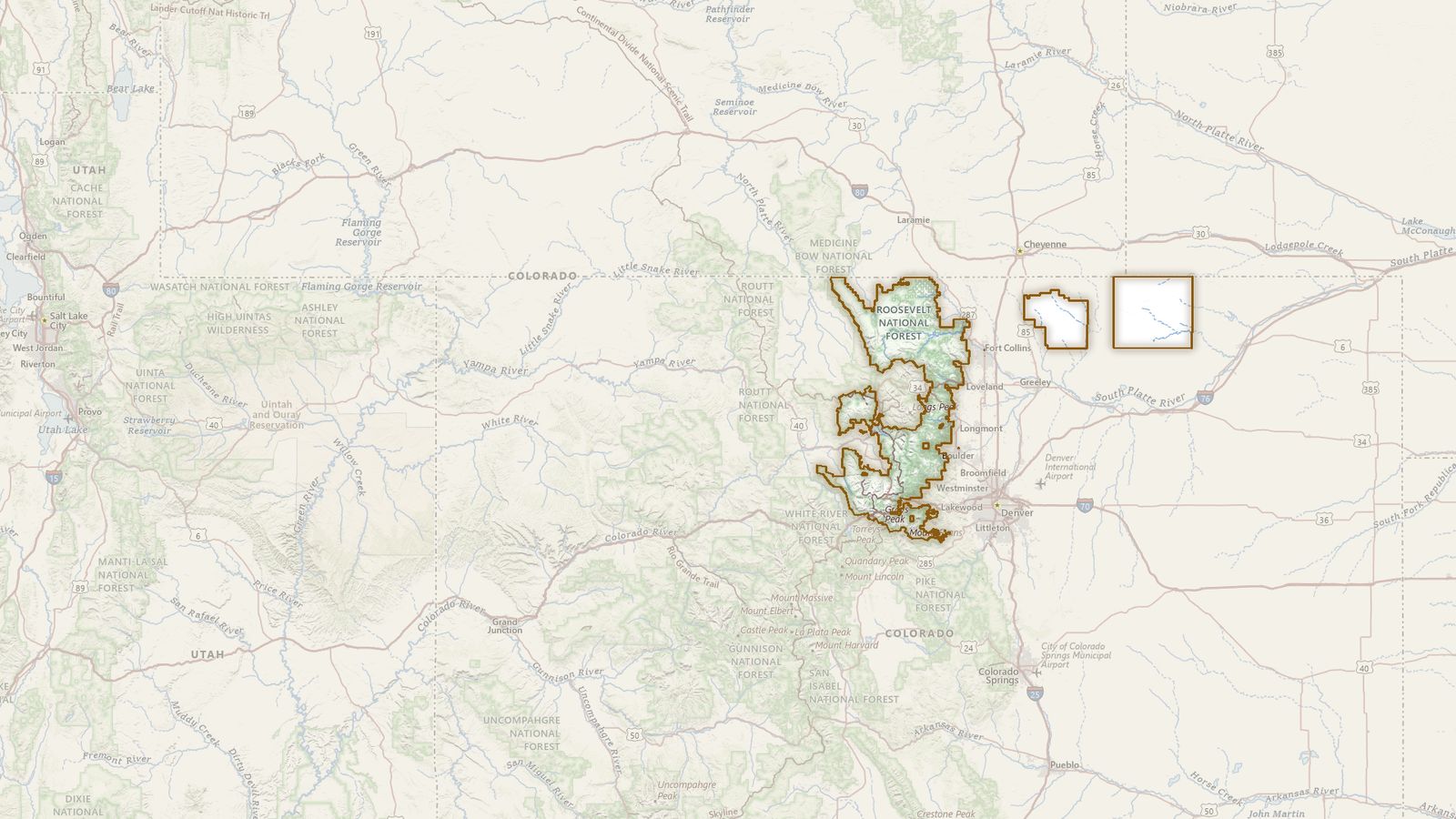 The boundary of the Arapaho and Roosevelt National Forests drawn on the USGS topographic map, with the towns, highways and rivers around it.