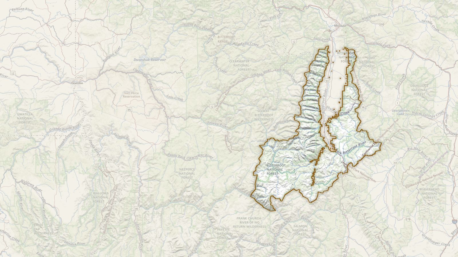 The boundary of the Bitterroot National Forest drawn on the USGS topographic map, with the towns, highways and rivers around it.