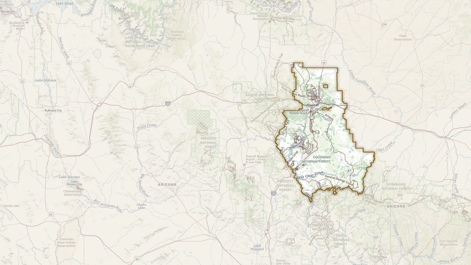 The boundary of the Coconino National Forest drawn on the USGS topographic map, with the towns, highways and rivers around it.
