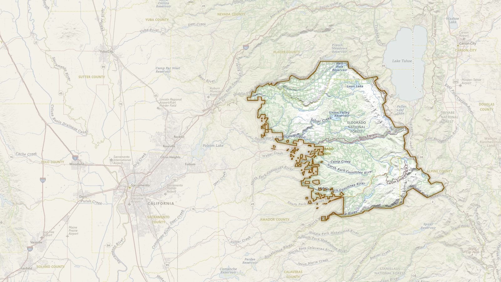 The boundary of the Eldorado National Forest drawn on the USGS topographic map, with the towns, highways and rivers around it.