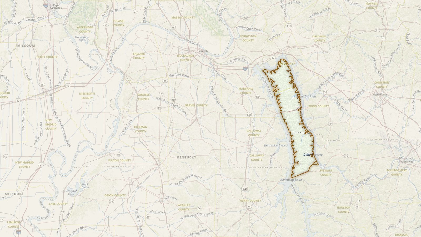 The boundary of the Land Between the Lakes National Recreation Area drawn on the USGS topographic map, with the towns, highways and rivers around it.