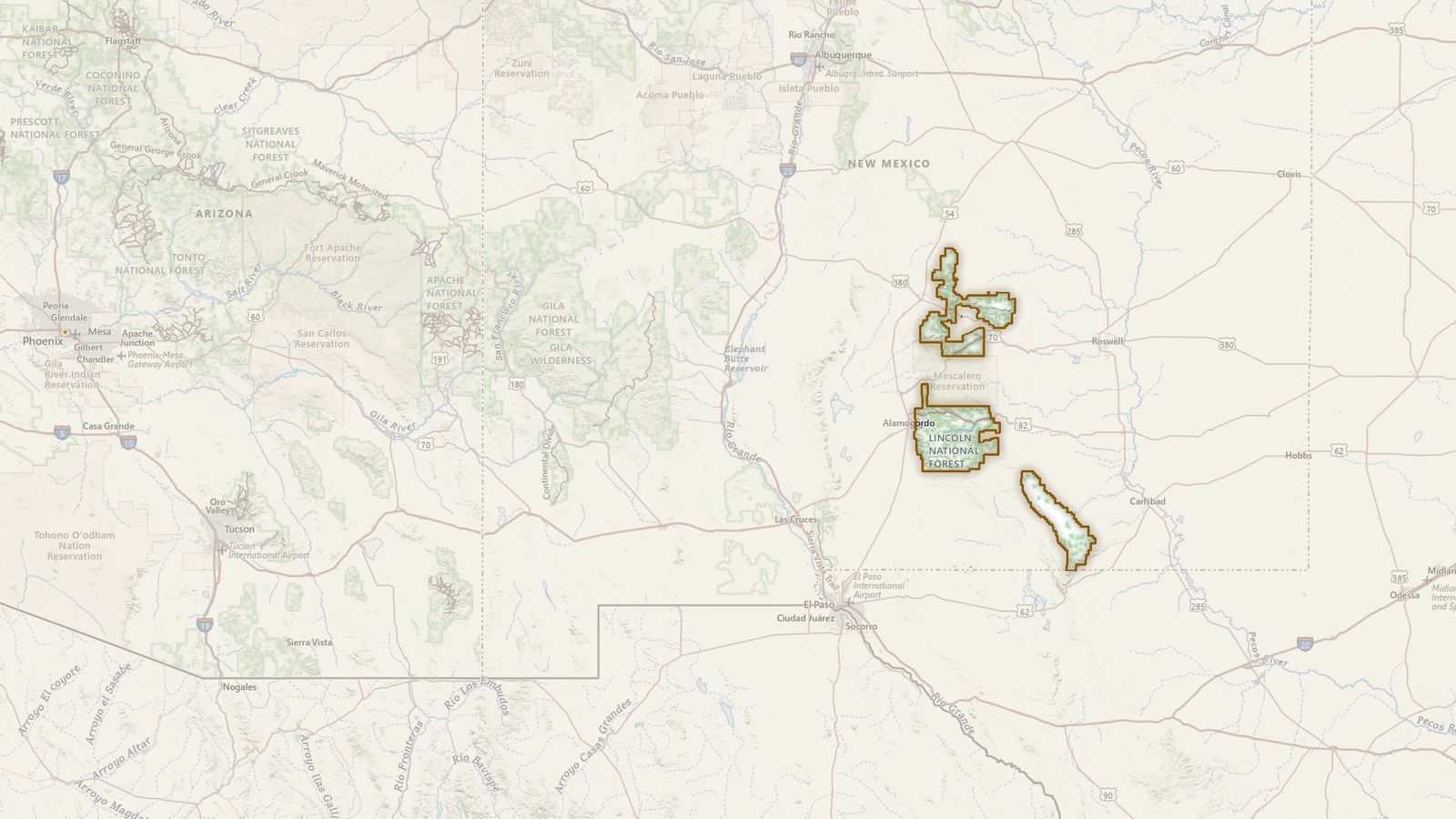 The boundary of the Lincoln National Forest drawn on the USGS topographic map, with the towns, highways and rivers around it.