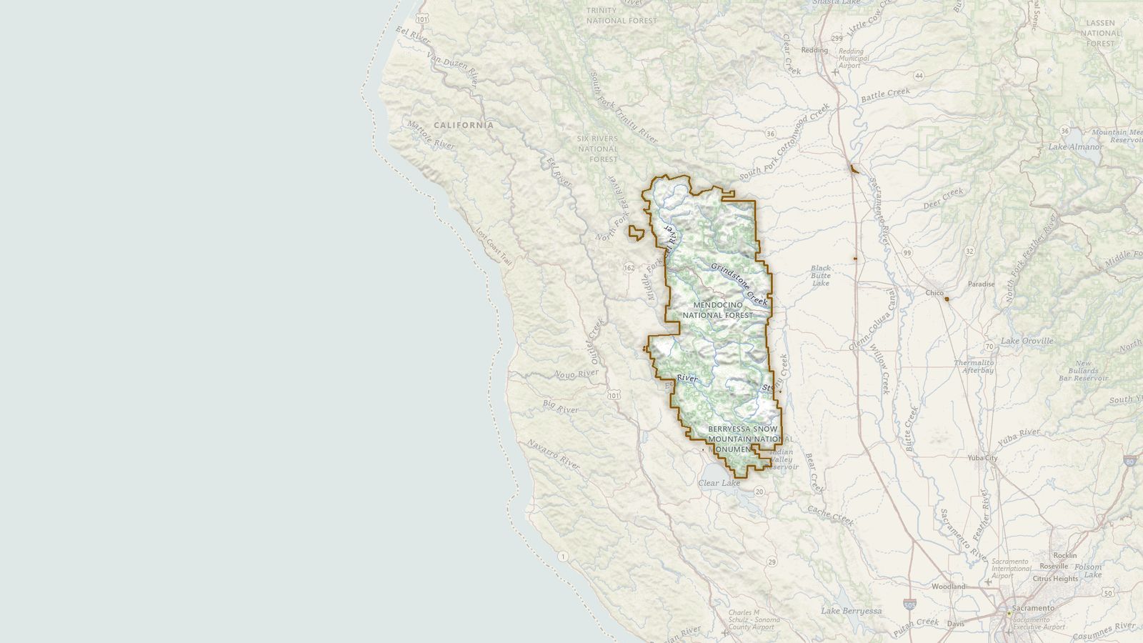 The boundary of the Mendocino National Forest drawn on the USGS topographic map, with the towns, highways and rivers around it.