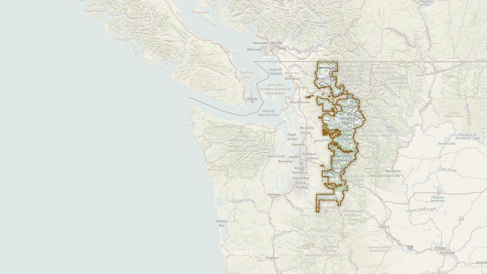 The boundary of the Mt. Baker-Snoqualmie National Forest drawn on the USGS topographic map, with the towns, highways and rivers around it.