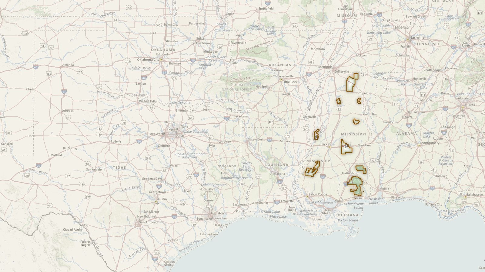 The boundary of the National Forests in Mississippi drawn on the USGS topographic map, with the towns, highways and rivers around it.