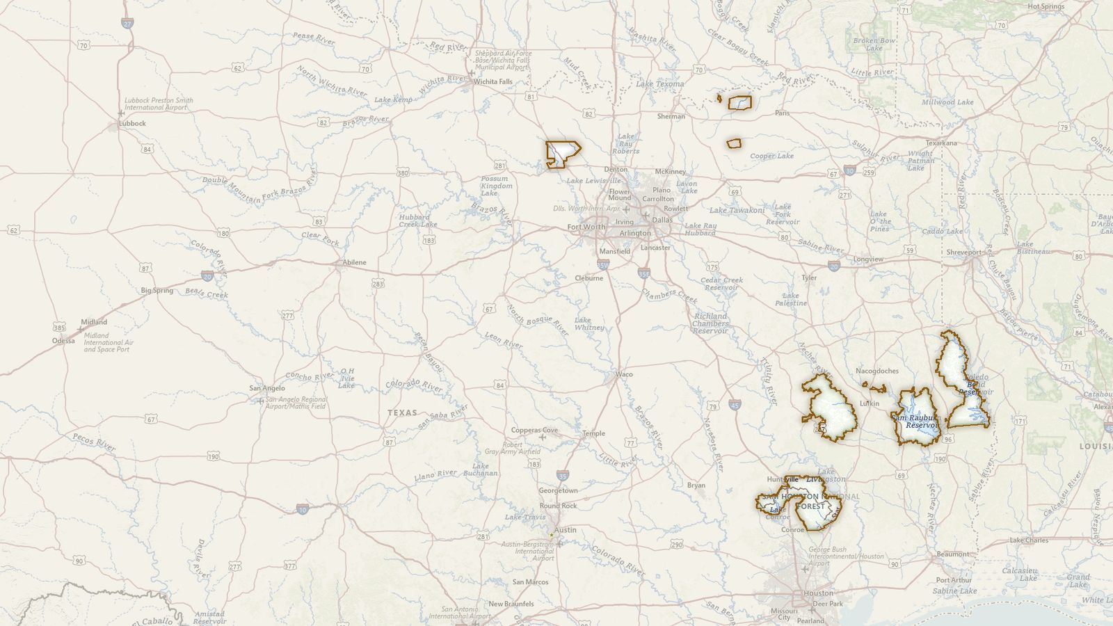 The boundary of the National Forests in Texas drawn on the USGS topographic map, with the towns, highways and rivers around it.