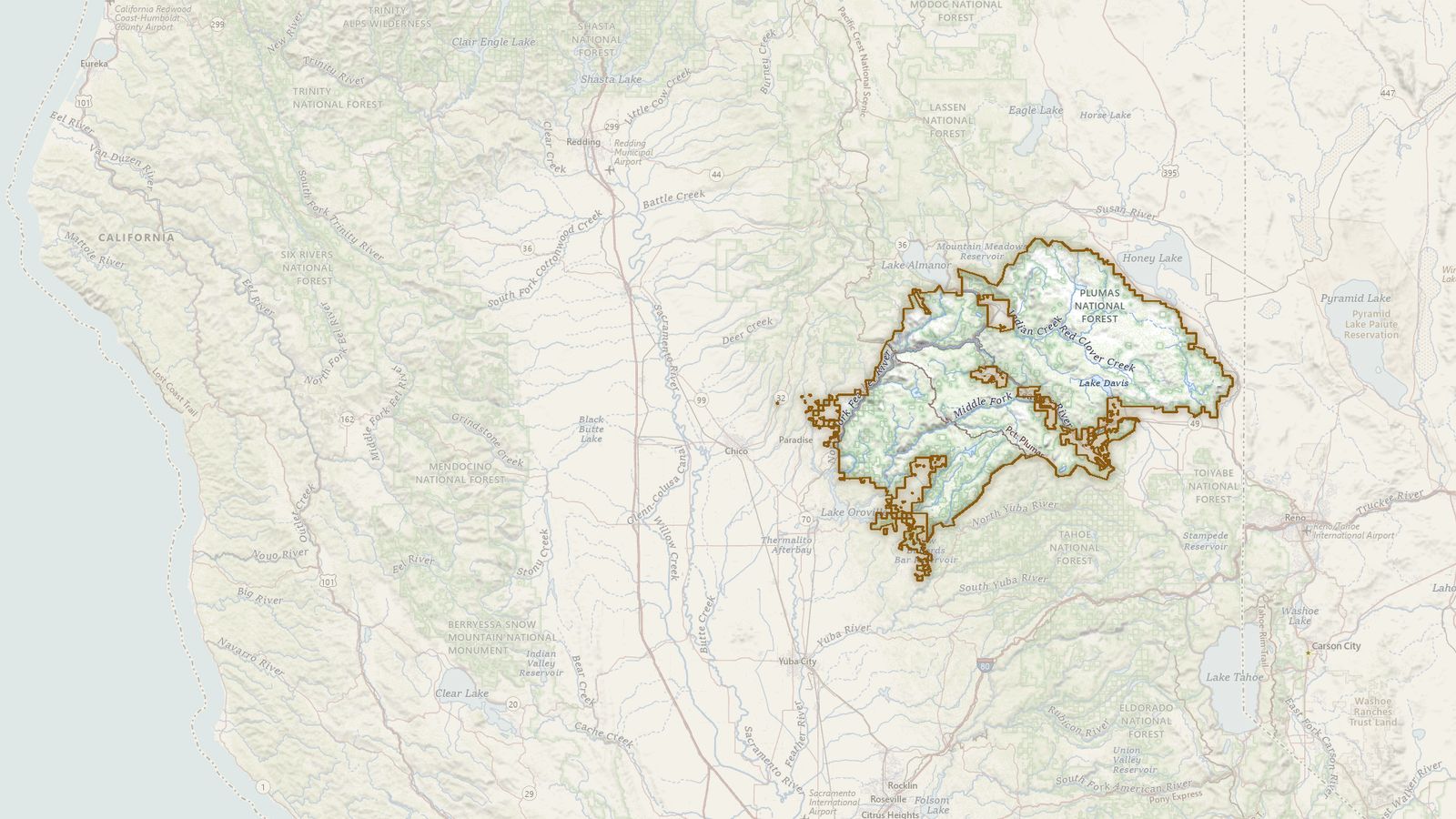The boundary of the Plumas National Forest drawn on the USGS topographic map, with the towns, highways and rivers around it.