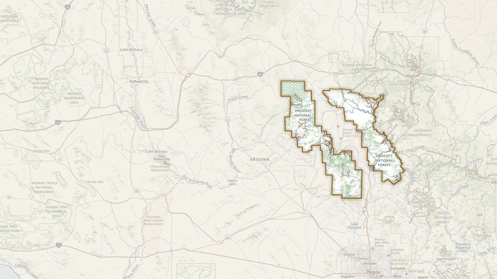 The boundary of the Prescott National Forest drawn on the USGS topographic map, with the towns, highways and rivers around it.