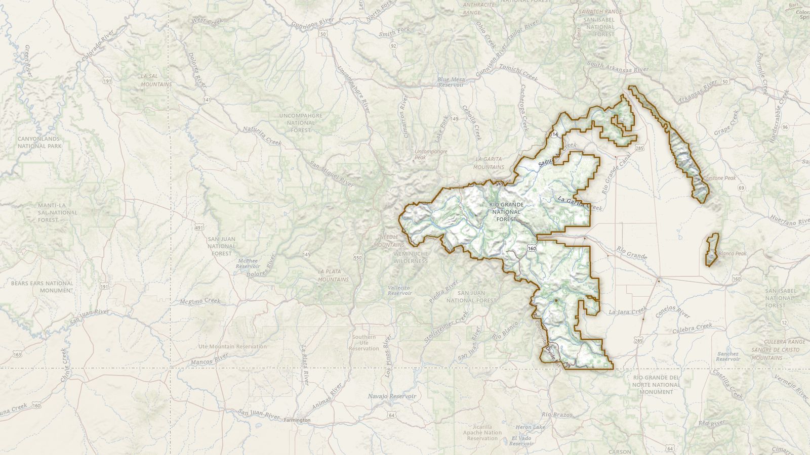 The boundary of the Rio Grande National Forest drawn on the USGS topographic map, with the towns, highways and rivers around it.