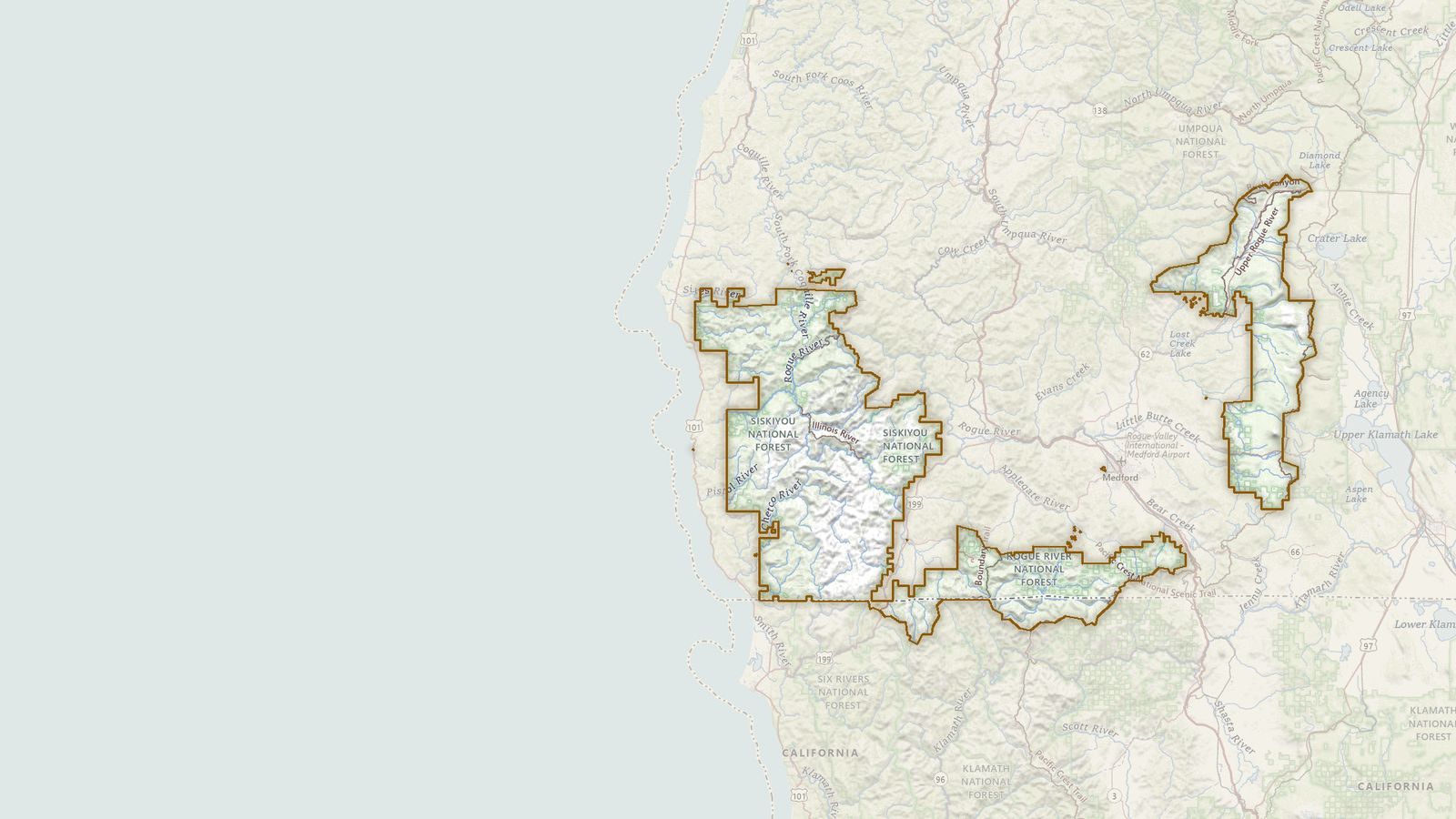 The boundary of the Rogue River-Siskiyou National Forests drawn on the USGS topographic map, with the towns, highways and rivers around it.