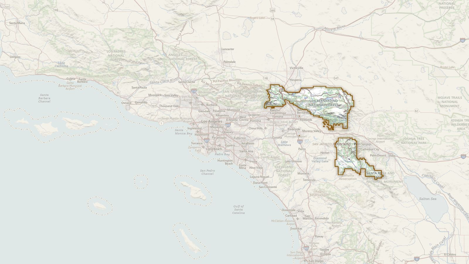 The boundary of the San Bernardino National Forest drawn on the USGS topographic map, with the towns, highways and rivers around it.