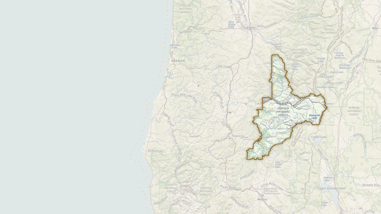 The boundary of the Umpqua National Forest drawn on the USGS topographic map, with the towns, highways and rivers around it.