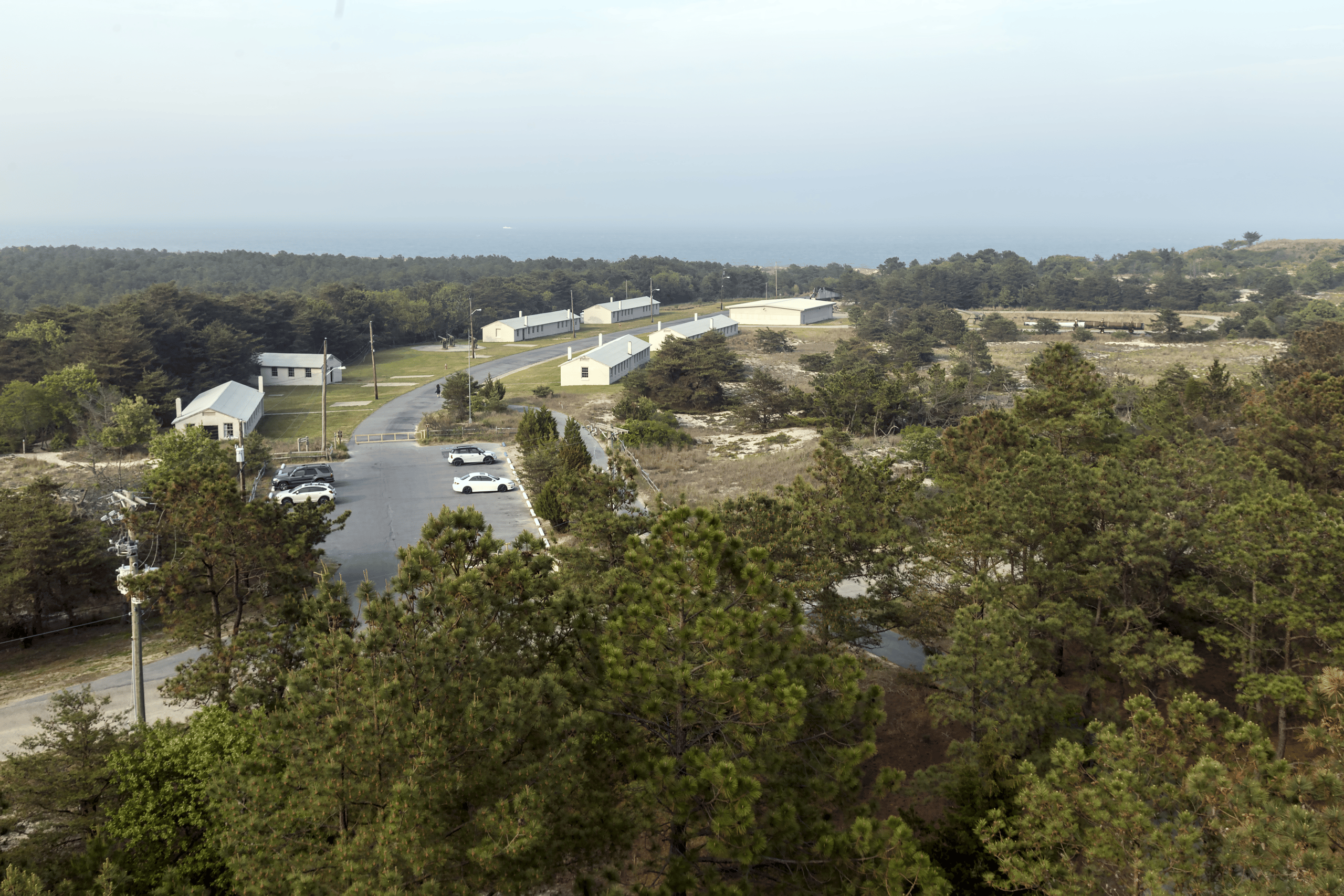 View of the Fort Miles barracks area from the top of an artillery spotting tower (Tower 7), looking towards the hazy Atlantic Ocean, Fort Miles, Delaware | Historic Sites In Delaware