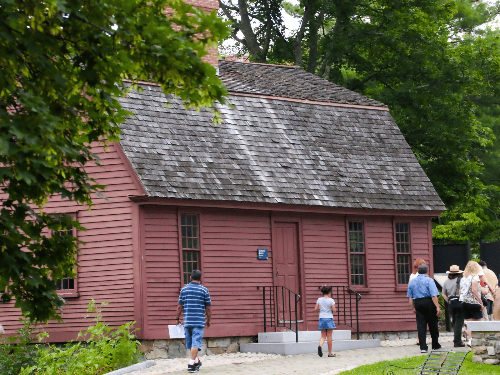 Visitors walking past the Sylvanus Brown House | Historic Sites In Rhode Island