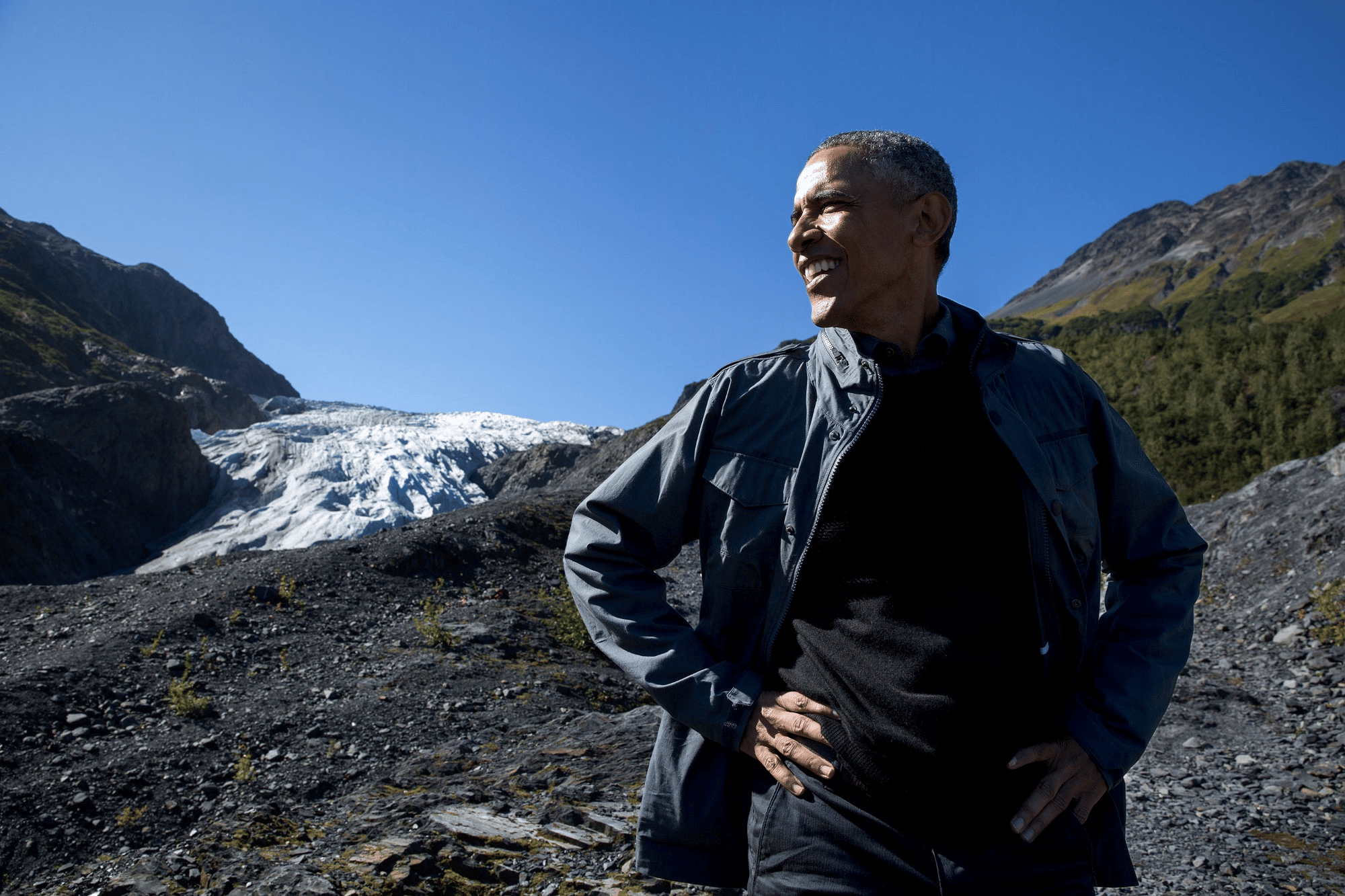 President Barack Obama stops for a break in Kenai Fjords National Park with Exit Glacier in the background