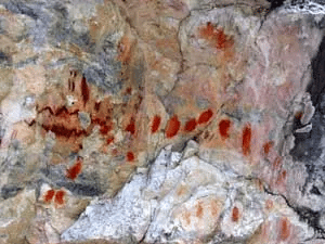 You can see abstract art like this painted onto the rock as well as fainter, human-like figures. We call these rock paintings "pictographs".
