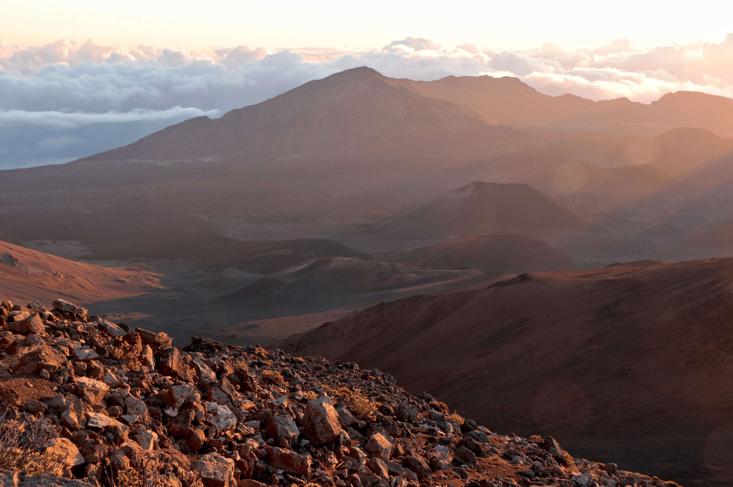 Early morning light suffuses the crater of Haleakala Volcano, Maui, Hawaii | Haleakala National Park Facts