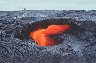 A peek through a "skylight" into the interior of an active lava tube