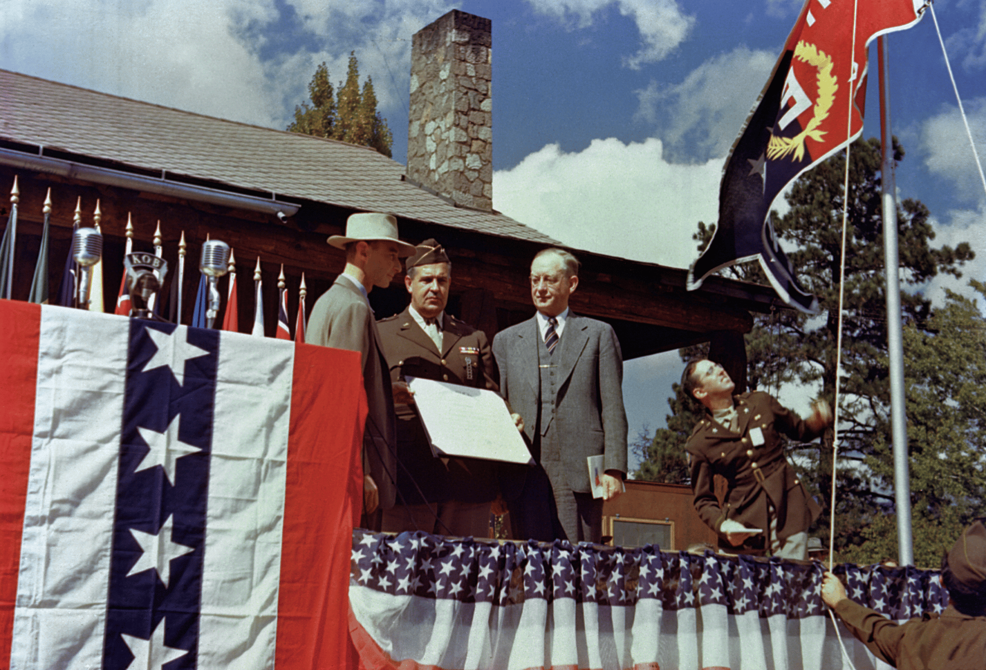 Los Alamos ranch house,16 October 1945. Robert Oppenheimer (left), Leslie Groves (center) and Robert Sproul (right) at the ceremony to present the Los Alamos Laboratory with the Army-Navy E Award