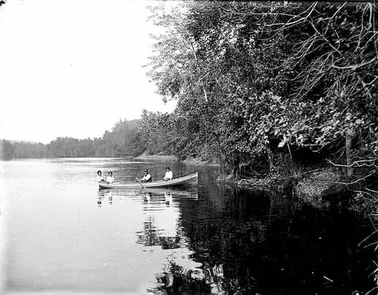 Family rowing on St. Croix River just below Twin Springs, near the Wisconsin shore