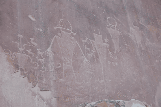 Human-shaped petroglyphs visible from the boardwalks along Utah Highway 24. These images were created by the Fremont Culture, who lived in this region for about 1000 years.