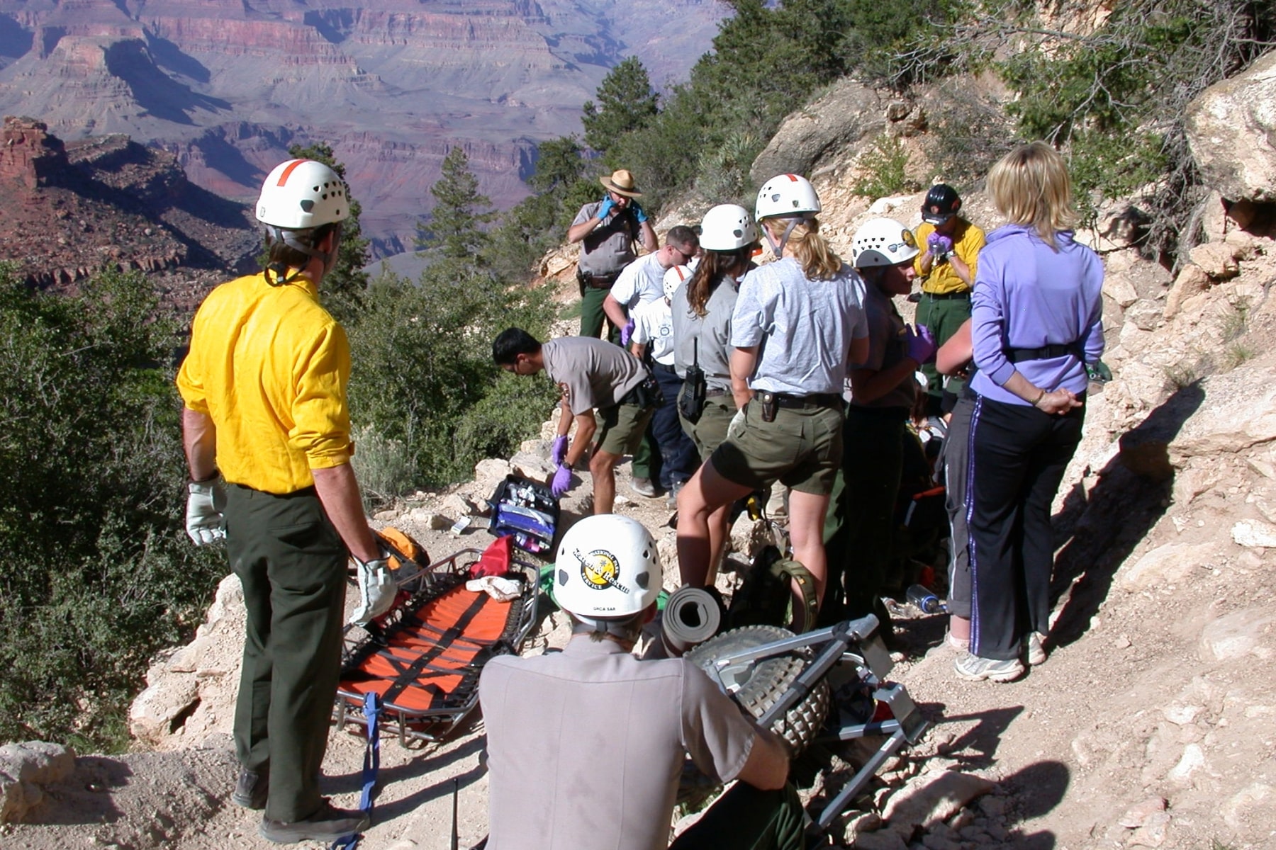 Grand Canyon Search and Rescue team on the side of steep canyon trail.