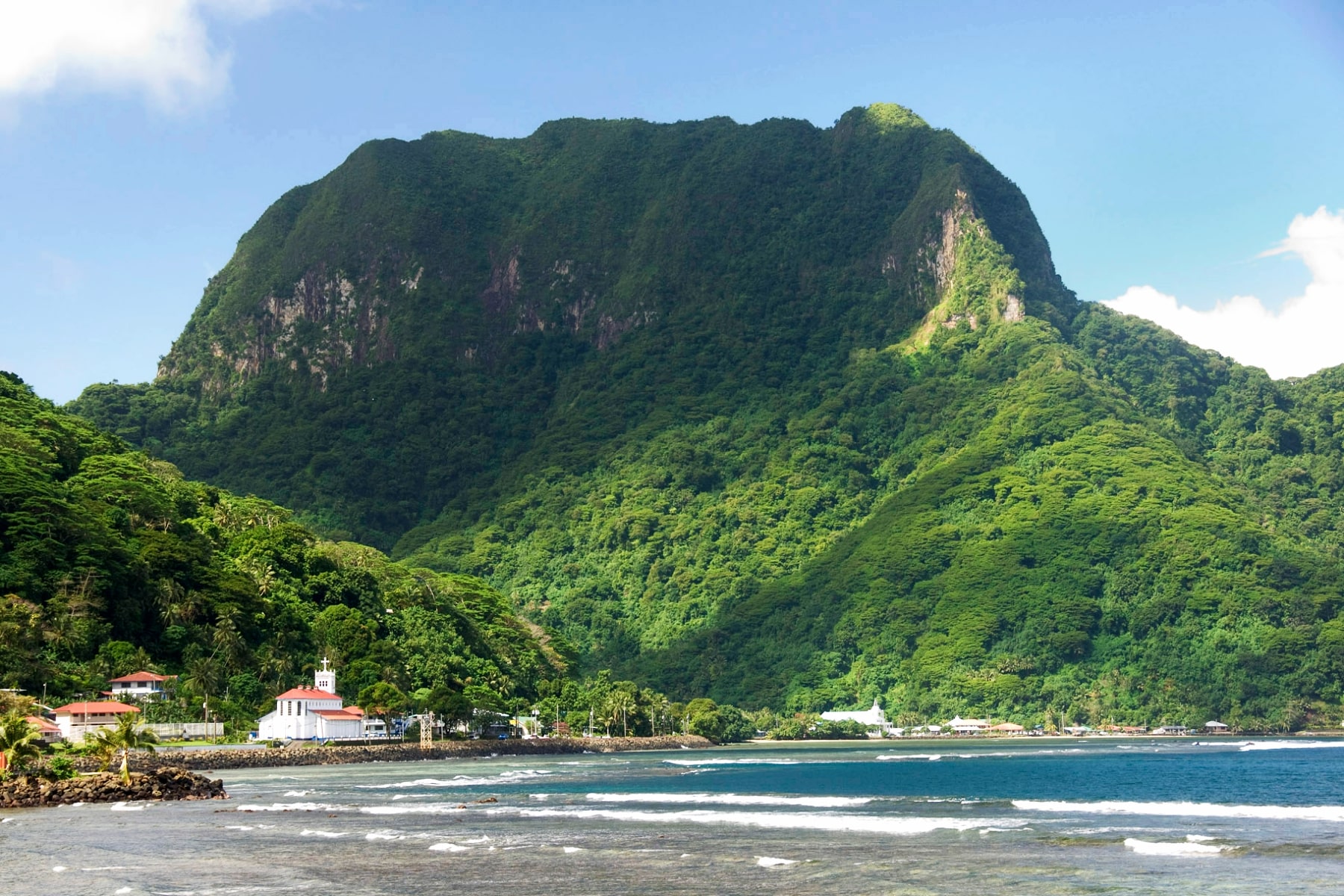 A tall green mountain known as the Rainmaker in American Samoa. 