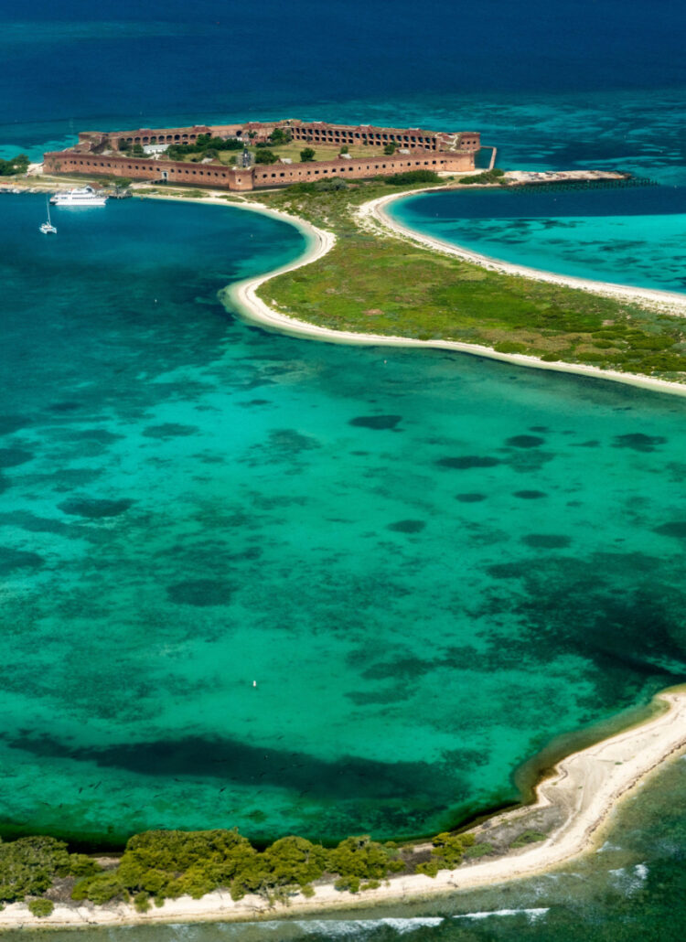 Aerial view of Dry Tortugas National Park with Garden, Bush, and Long Key in view in the shape of the letter J.