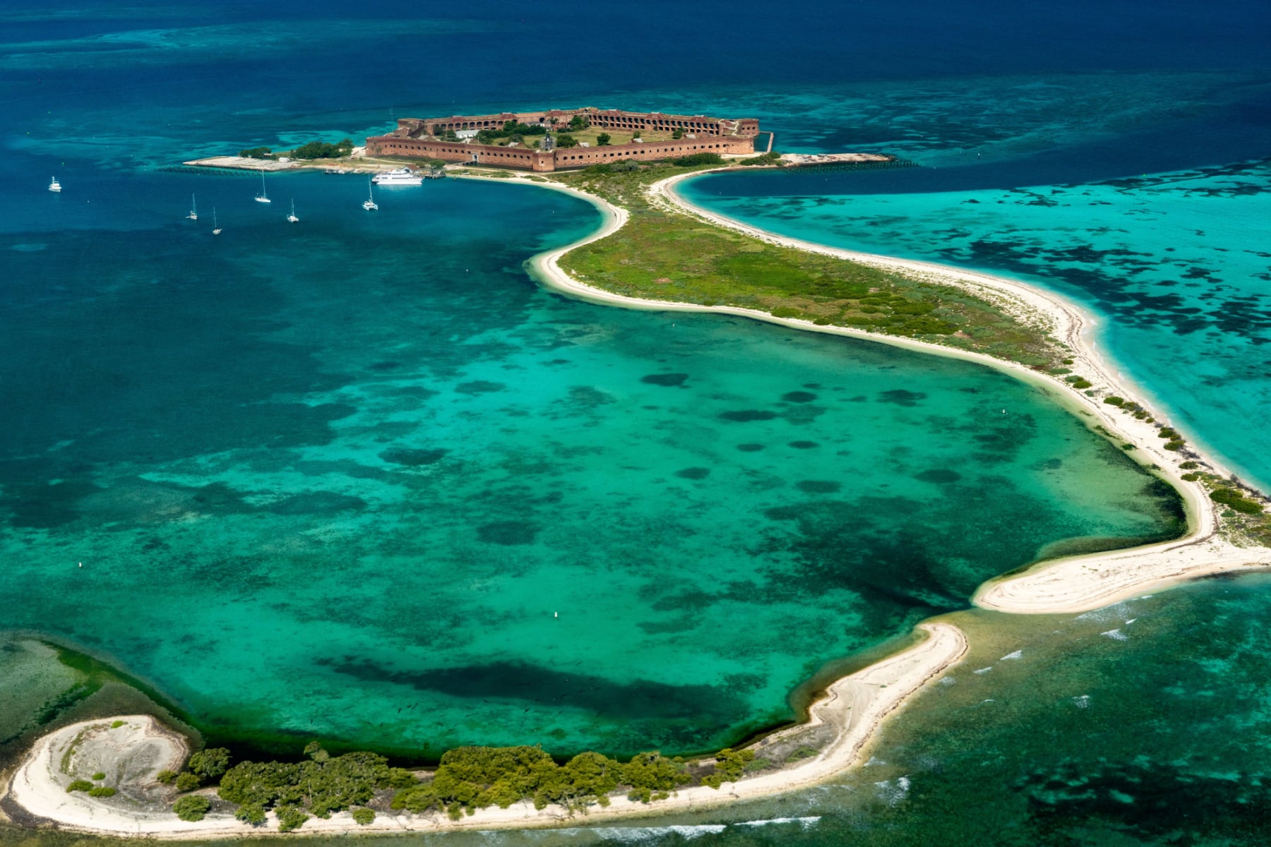 Aerial view of Dry Tortugas National Park with Garden, Bush, and Long Key in view in the shape of the letter J.