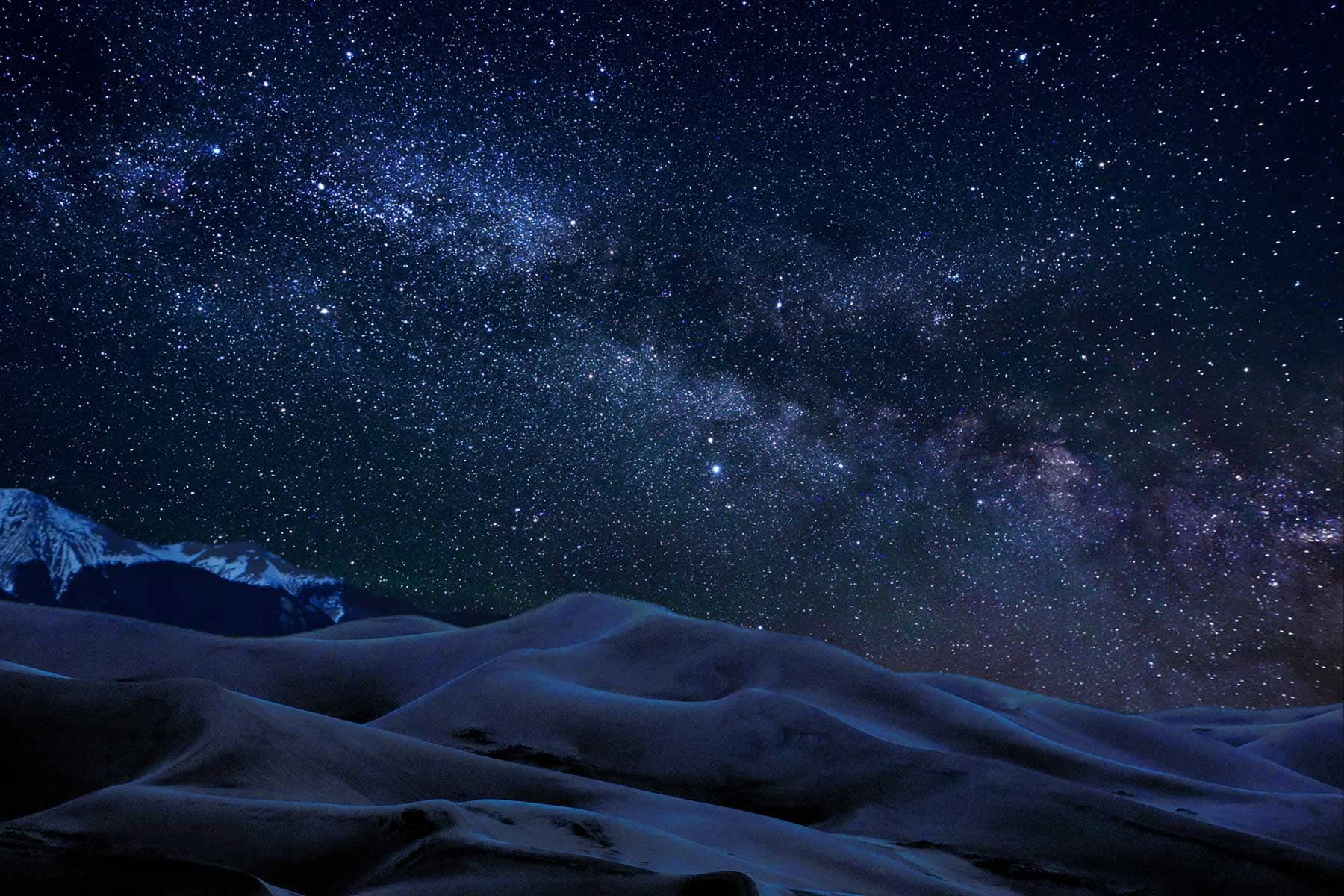 Sand Dunes below a starry sky at Great Sand Dunes National Park. 