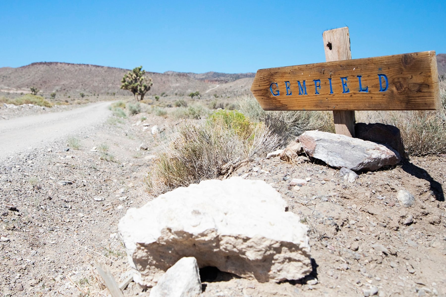 Gemfield Nevada sign on desert road