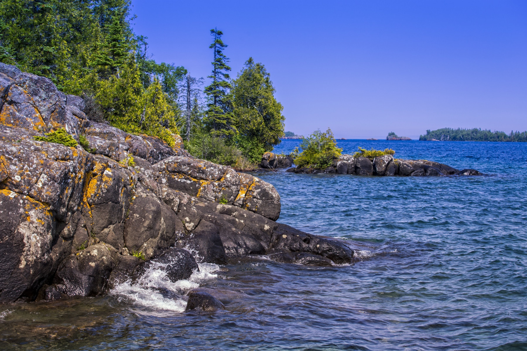 The rocky shoreline of Isle Royale National Park where it meets Lake Superior.