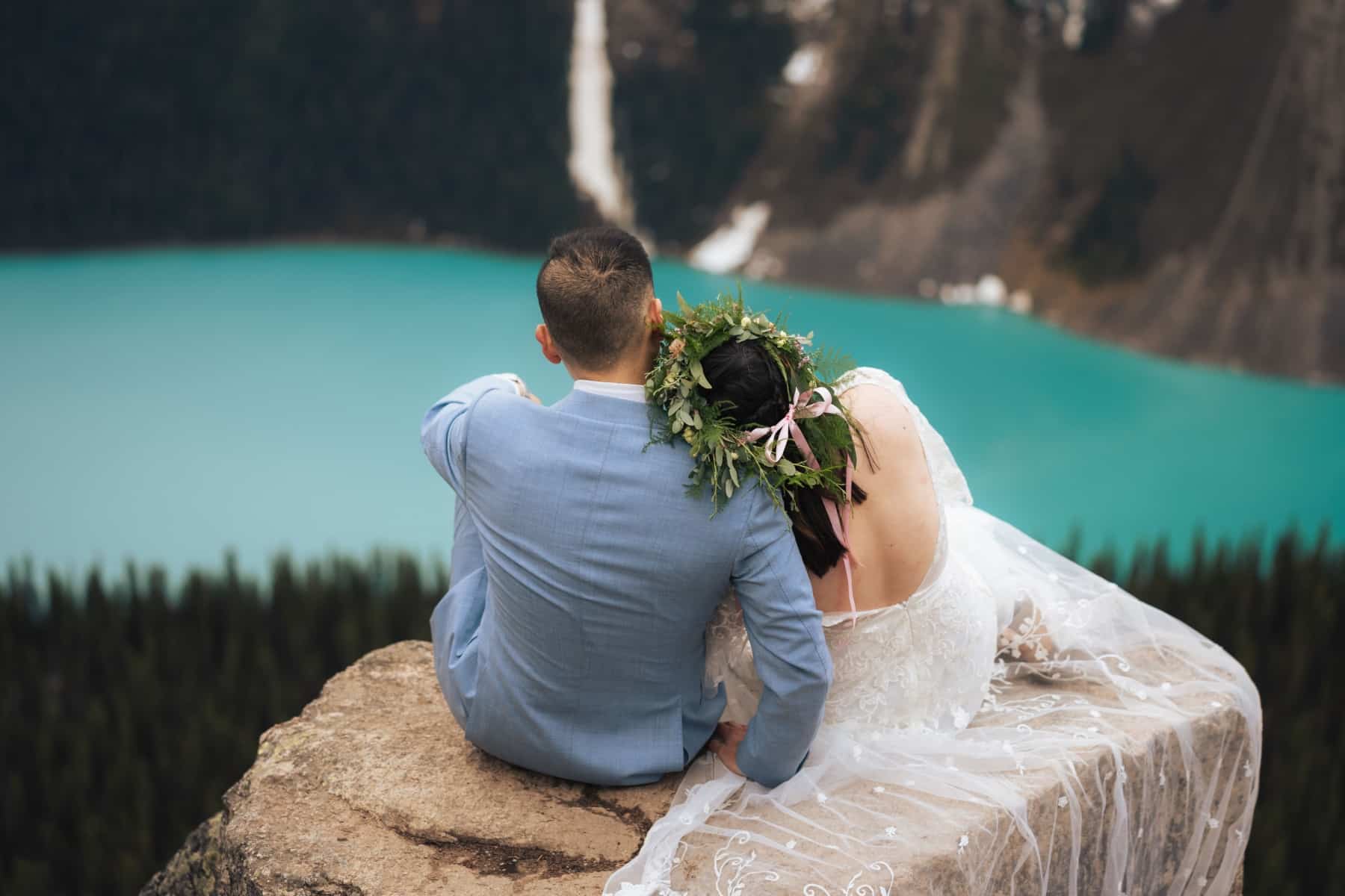 National park wedding couple overlooking glacier lake